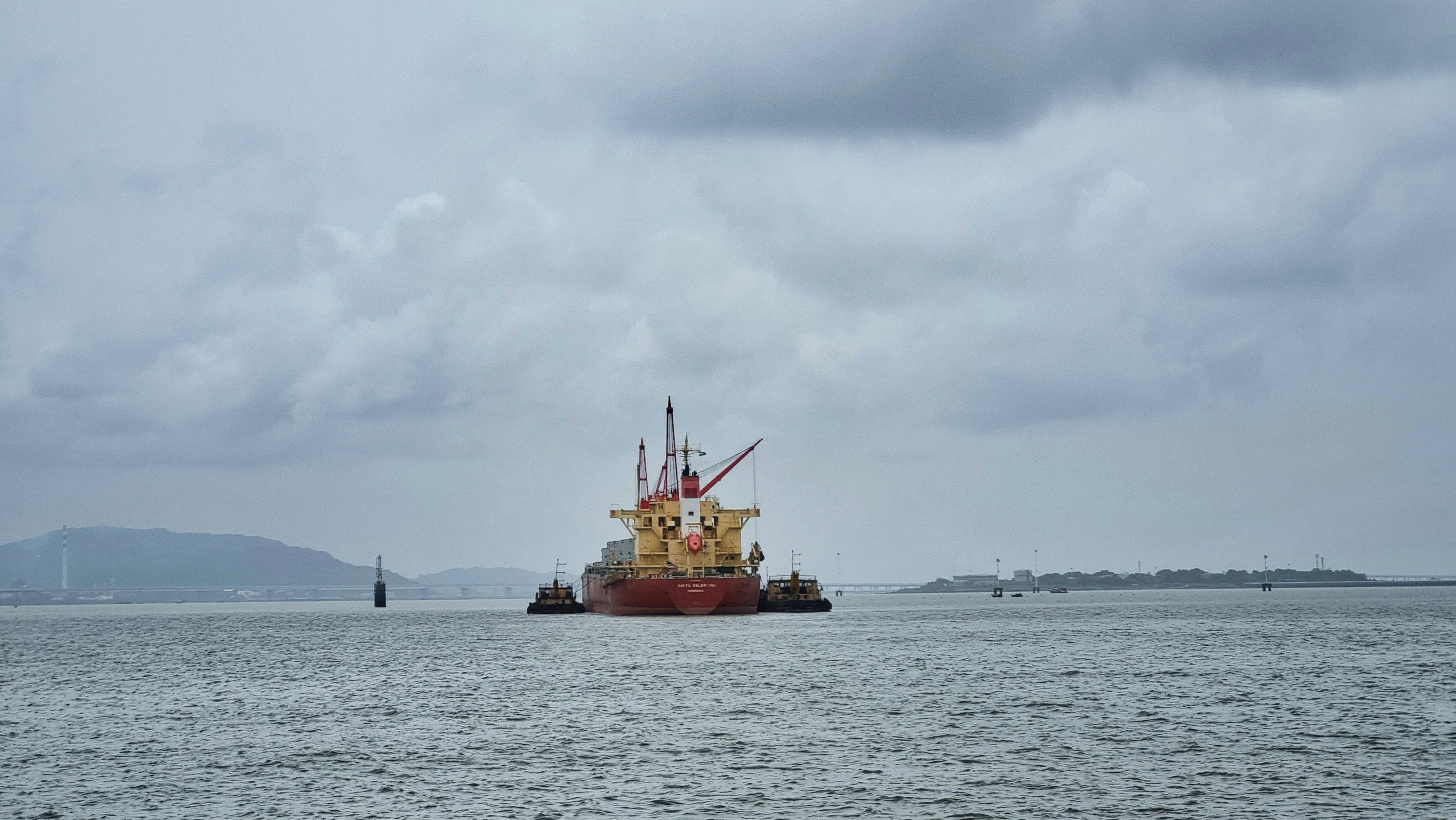 A large boat floating on top of a large body of water