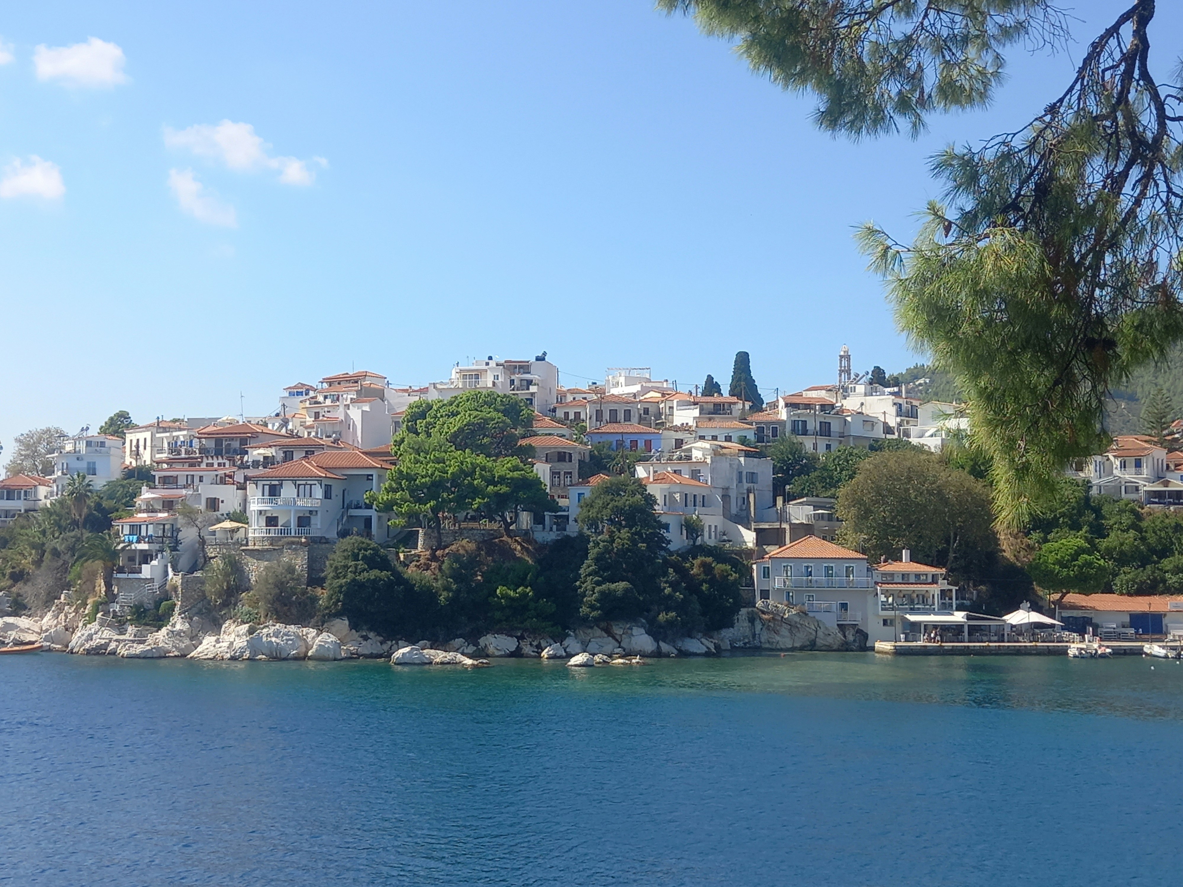 Tangier port with fishing boats and the white medina rising on the hillside