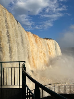 A large waterfall with water coming out of it