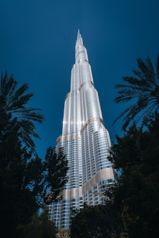 The burj building is lit up at night