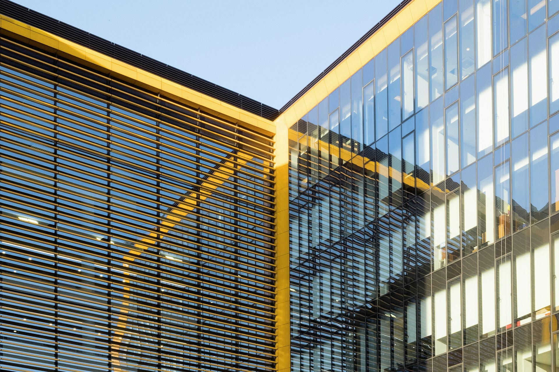 A tall building with a lot of windows next to it