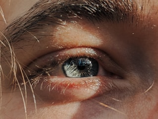 A close up of a person's blue eye