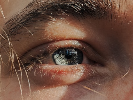 A close up of a person's blue eye