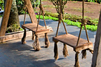 A couple of wooden benches sitting next to each other
