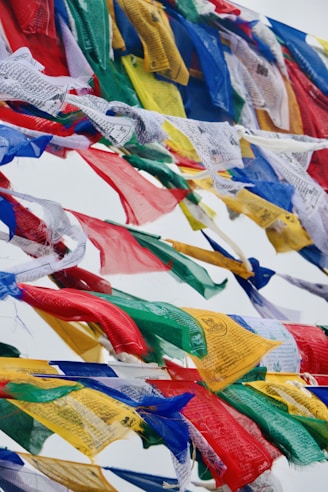 A bunch of colorful flags flying in the air