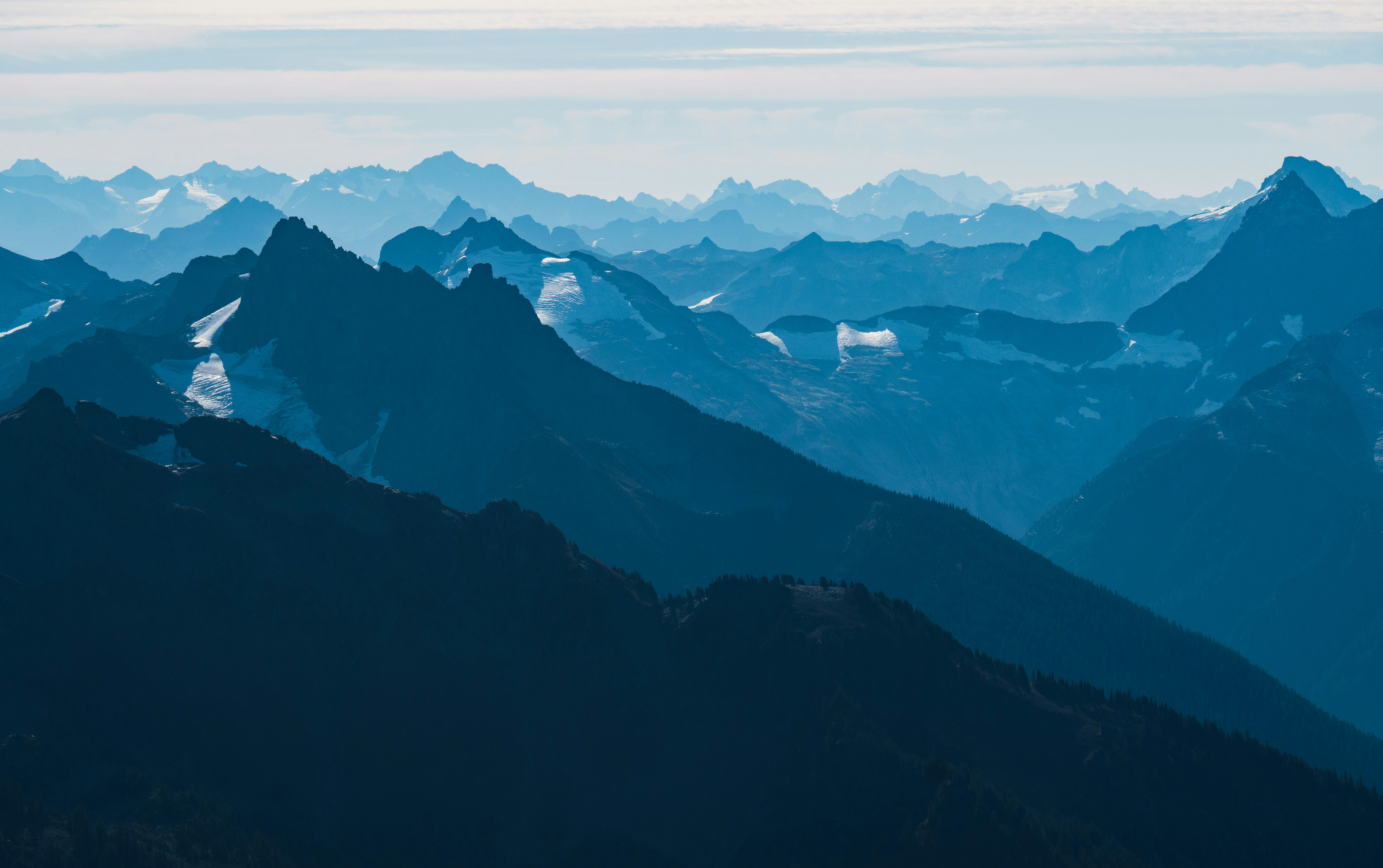A view of a mountain range from the top of a mountain