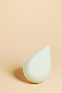 A small white object sitting on top of a table