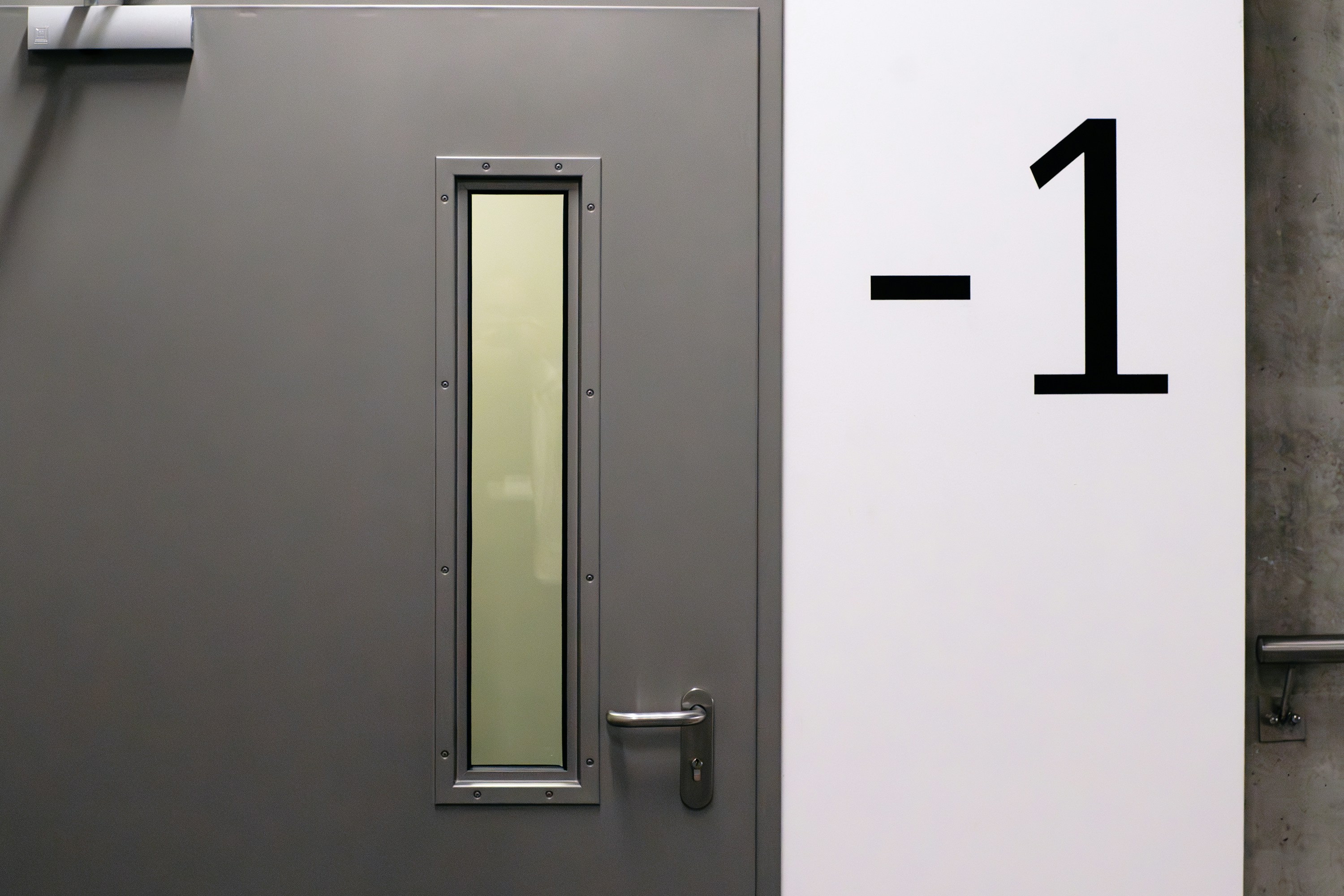 Office park lot exit door minus one floor basement.