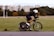 A man riding a bike down a street