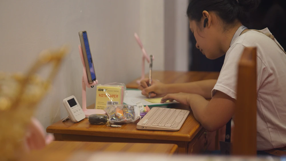 Engineering student working at a desk with a computer