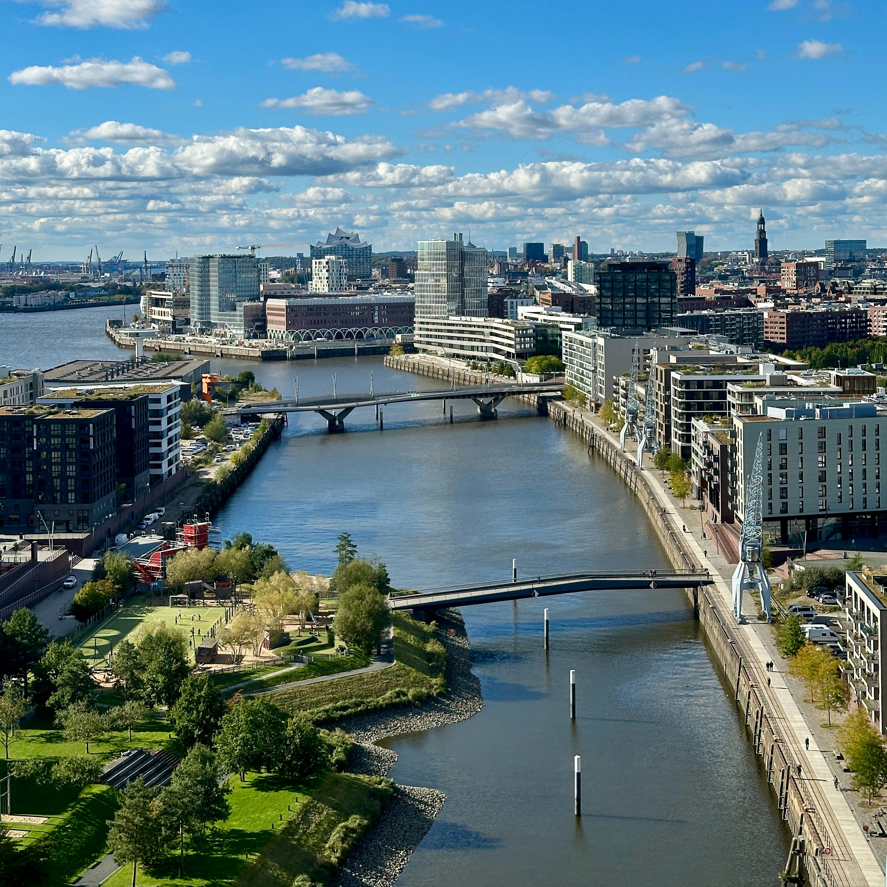 A river running through a city next to a bridge