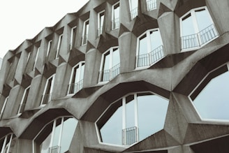A tall building with many windows and balconies