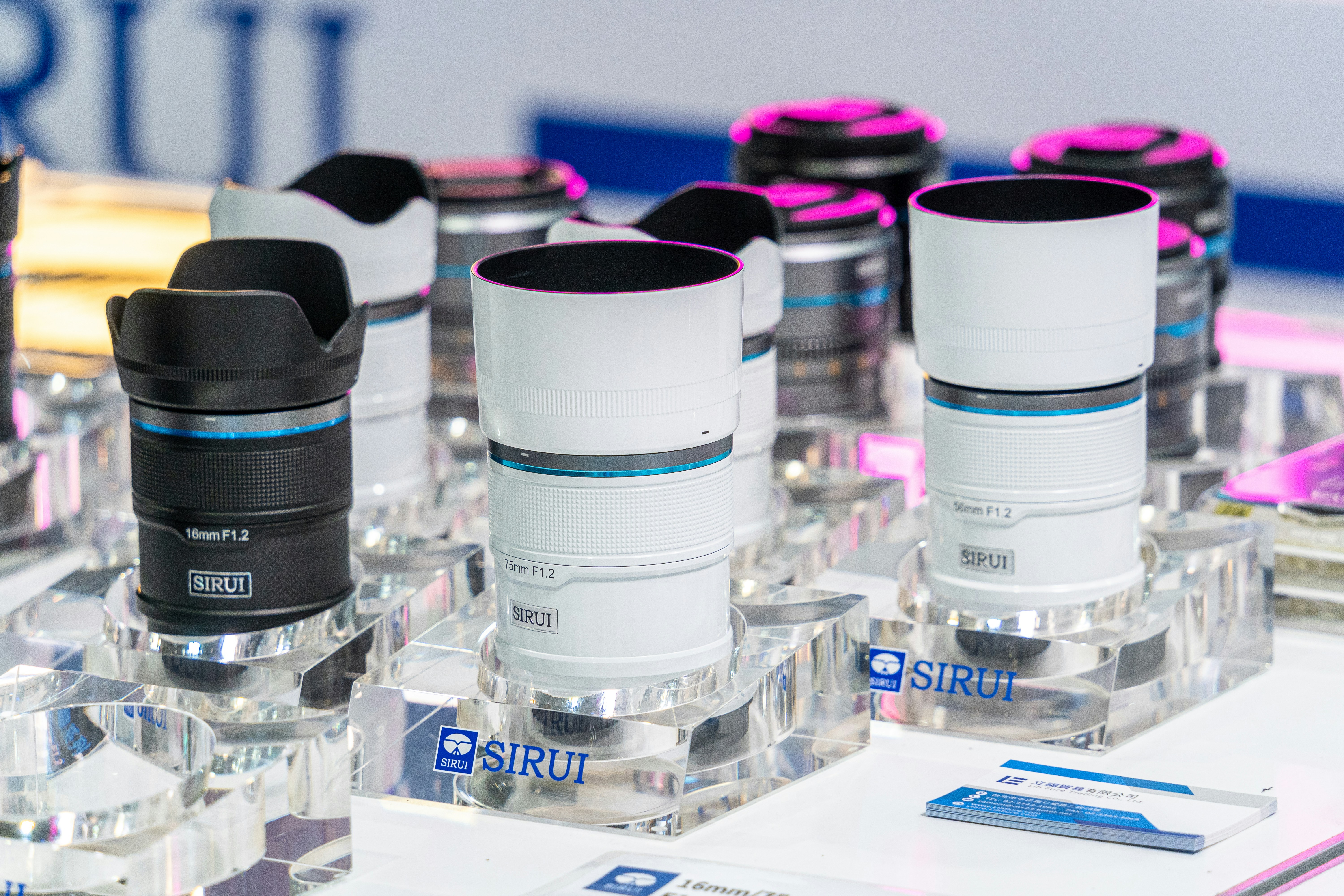 A group of bottles of water sitting on top of a table