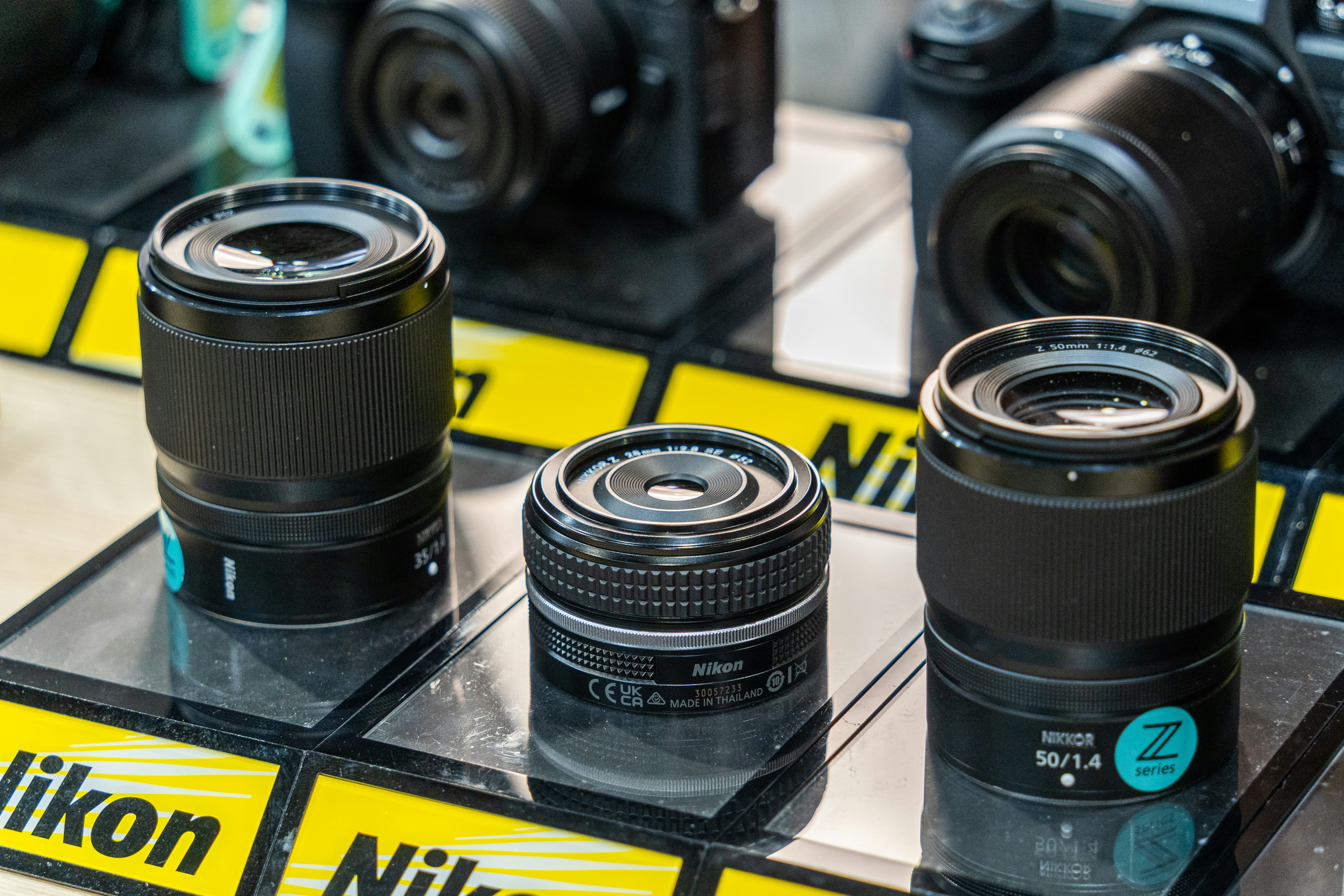A group of cameras sitting on top of a table