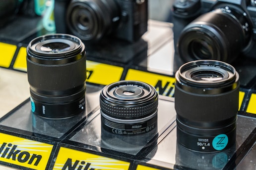 A group of cameras sitting on top of a table