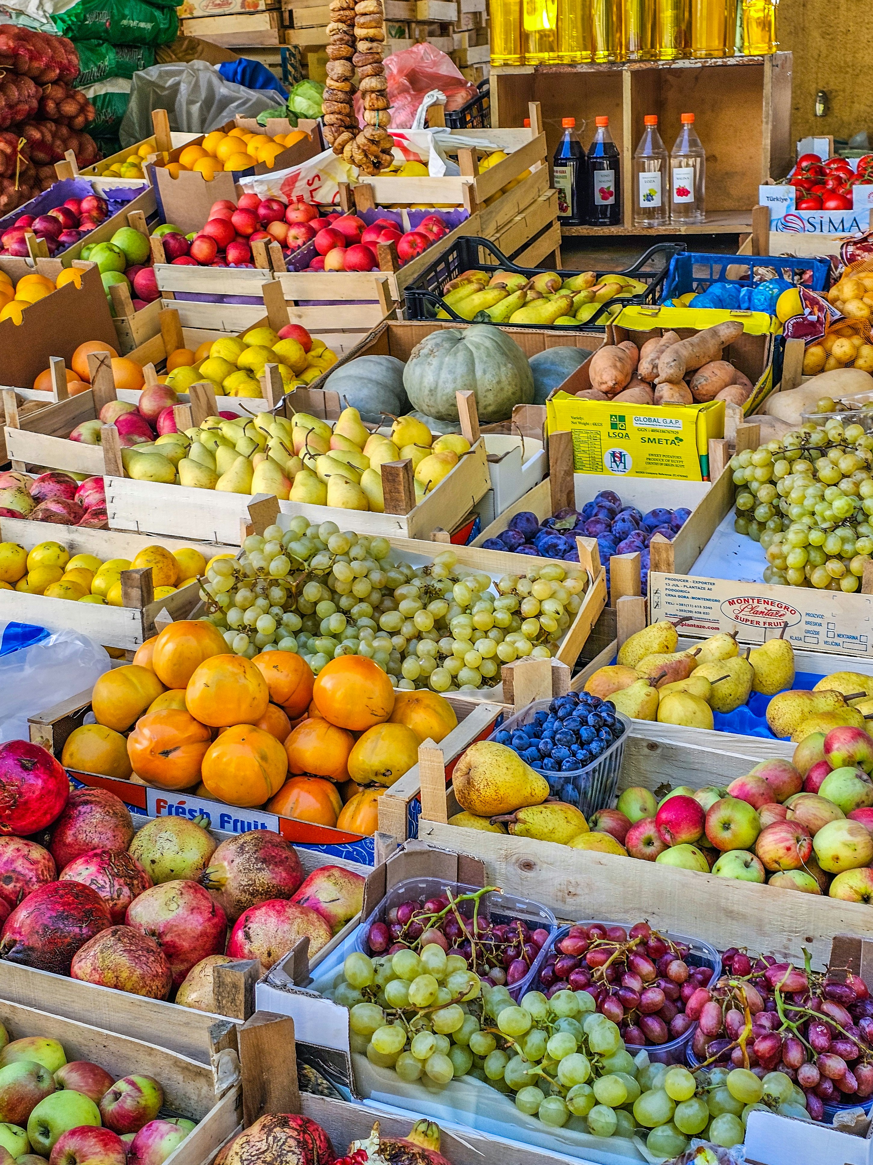 Autumn harvest fresh-cut fruit box with persimmon, Asian pear, and Concord grapes