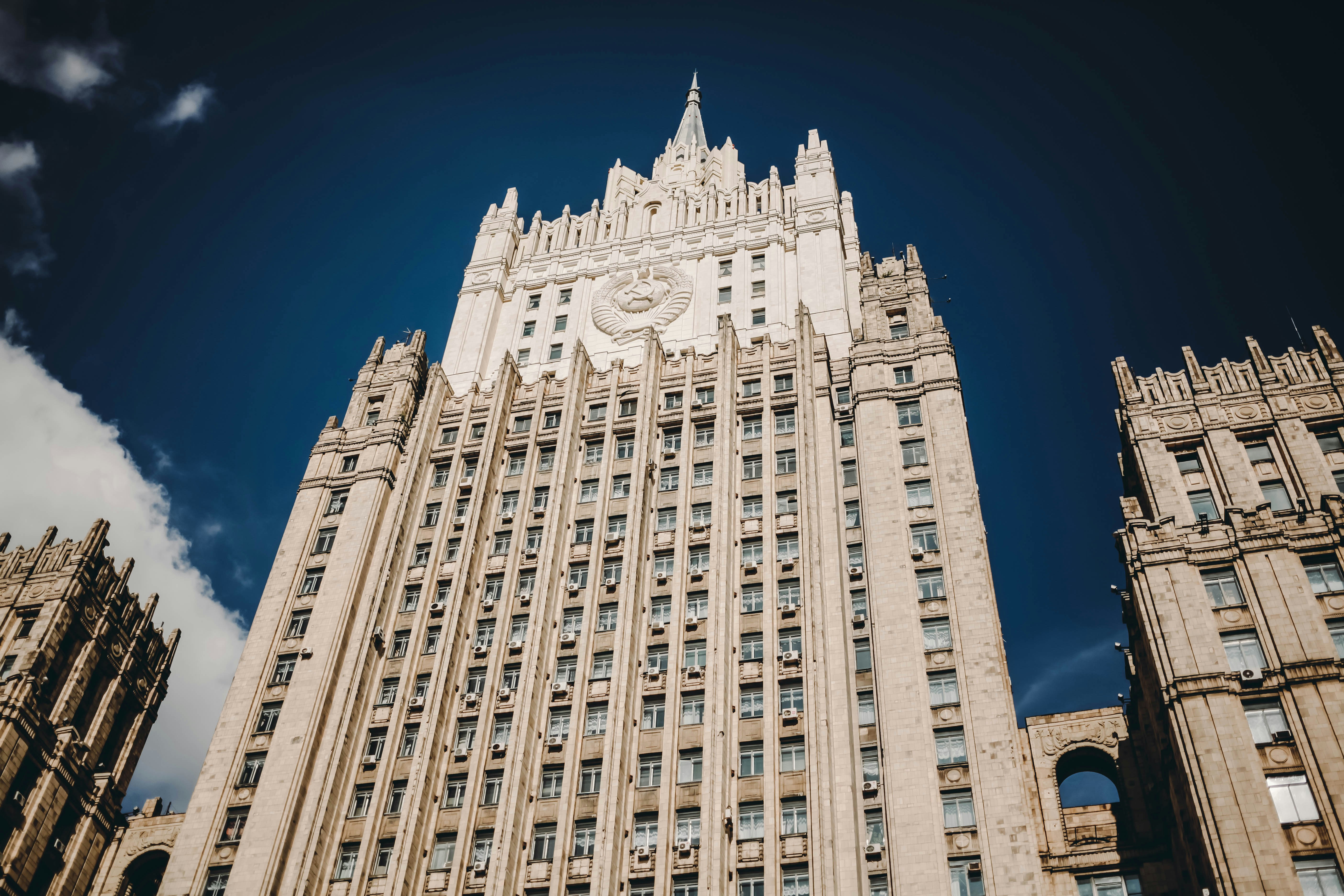 A very tall building with a clock on it's side