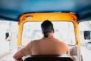 A man sitting in a chair in the back of a truck
