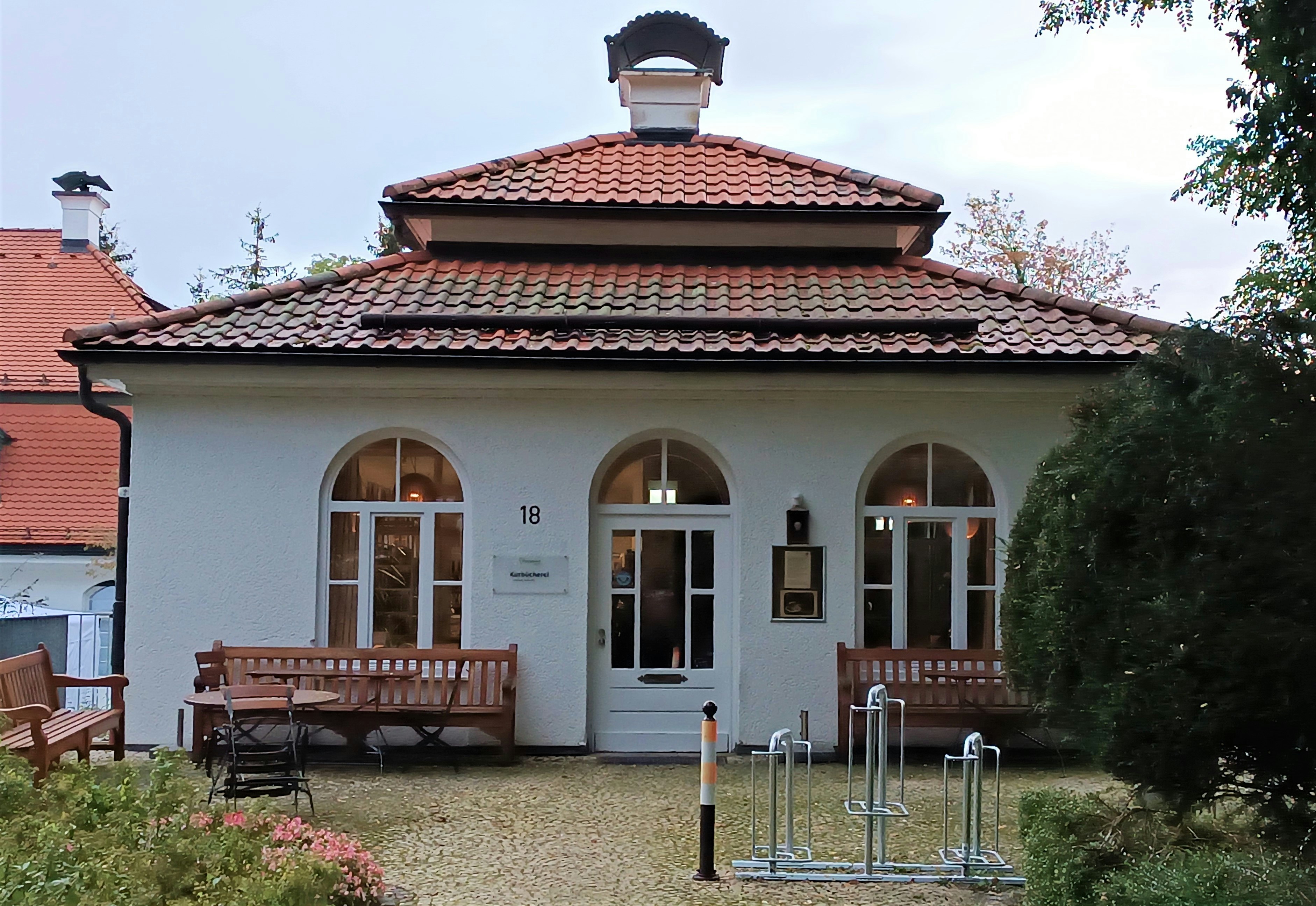 A white house with a red tiled roof