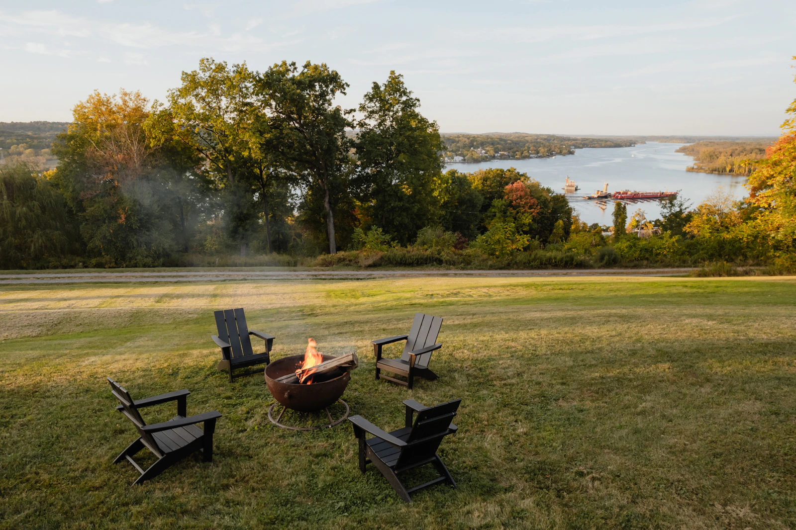Hudson River view and open green field in Hudson, New York