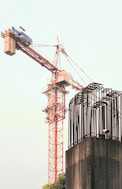 A crane is standing on top of a building