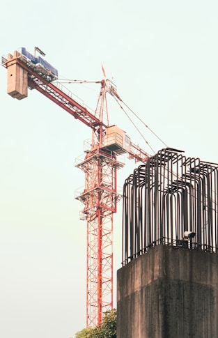 A crane is standing on top of a building