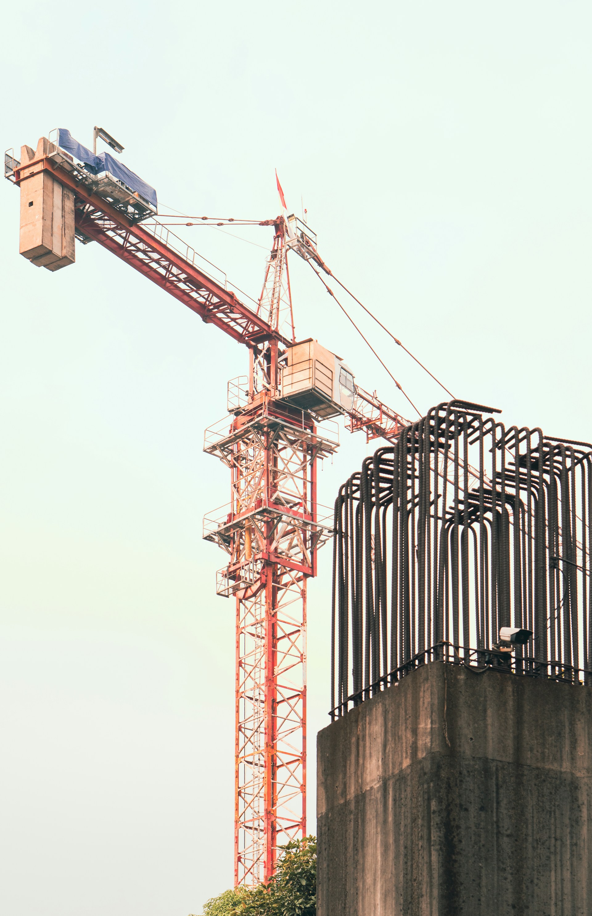 A crane is standing on top of a building