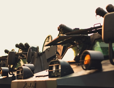 A row of military tanks sitting next to each other