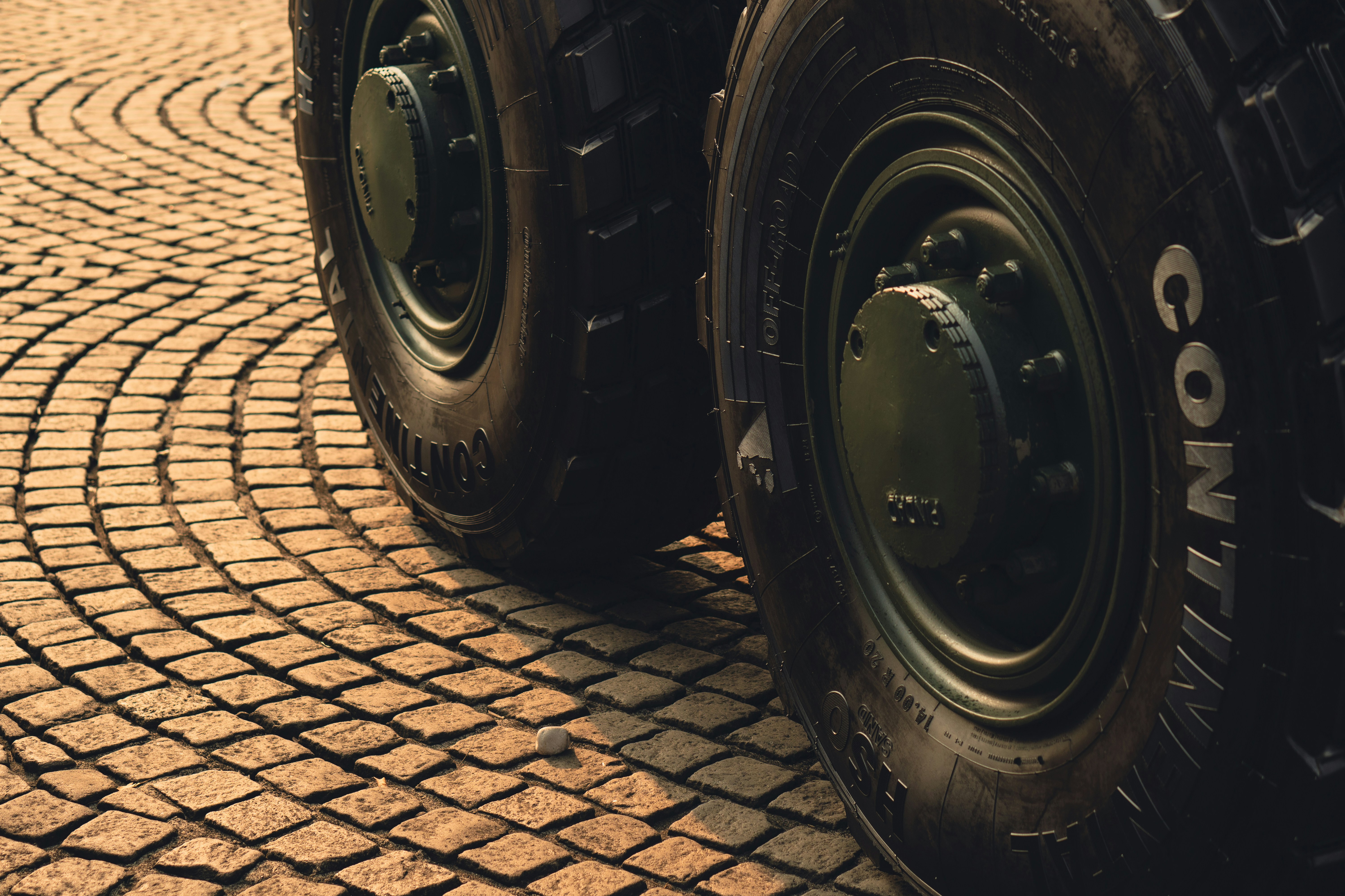 A close up of two large tires on a truck