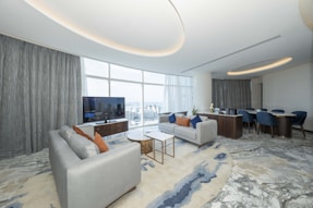 A living room filled with furniture and a flat screen TV