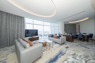 A living room filled with furniture and a flat screen TV