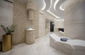 A bathroom with a tub, sink, and toilet in it