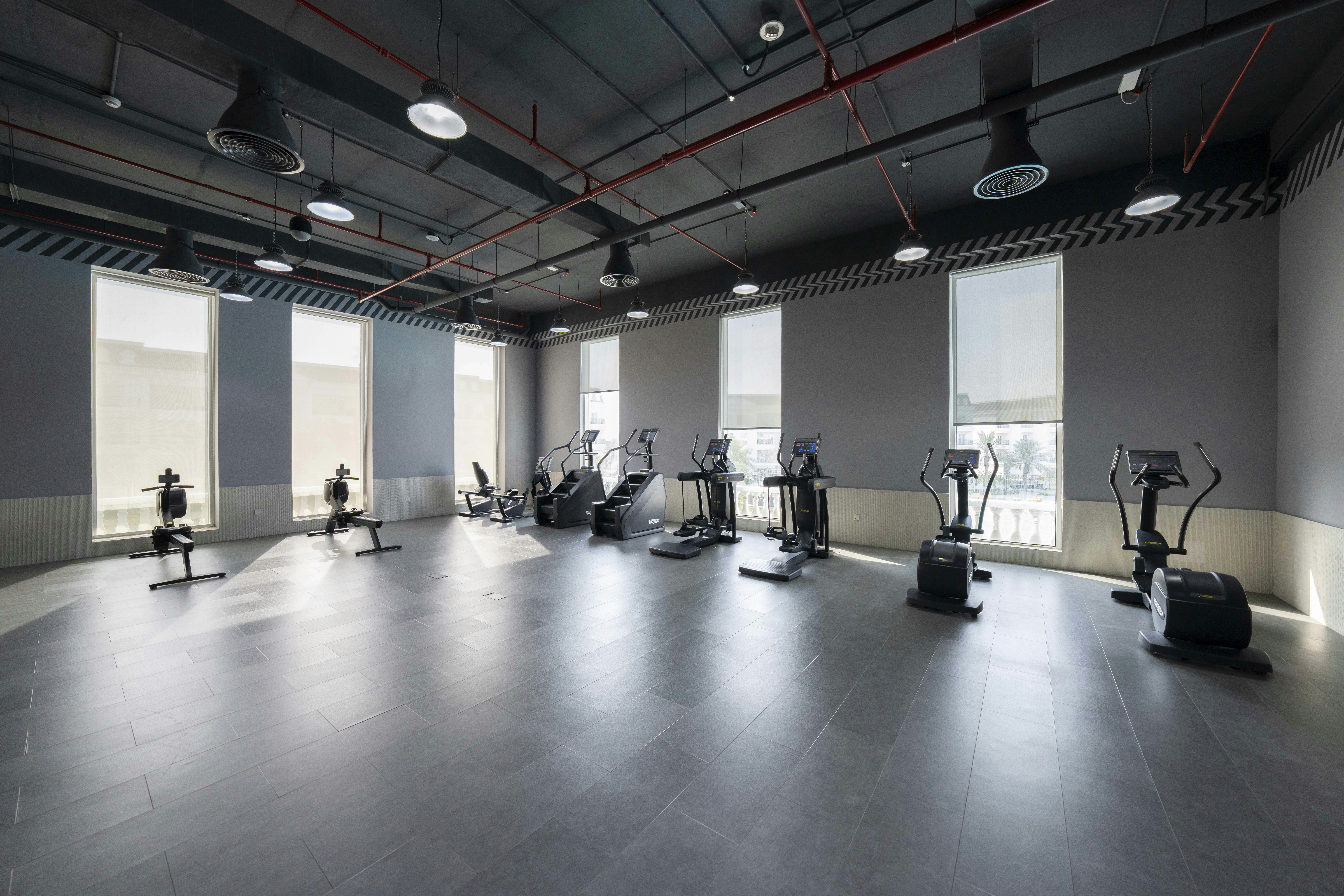 Clean and spacious workout area with a wide array of equipment