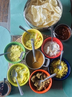 A table topped with bowls of different types of food