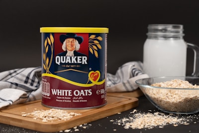 A can of oats next to a bowl of oats