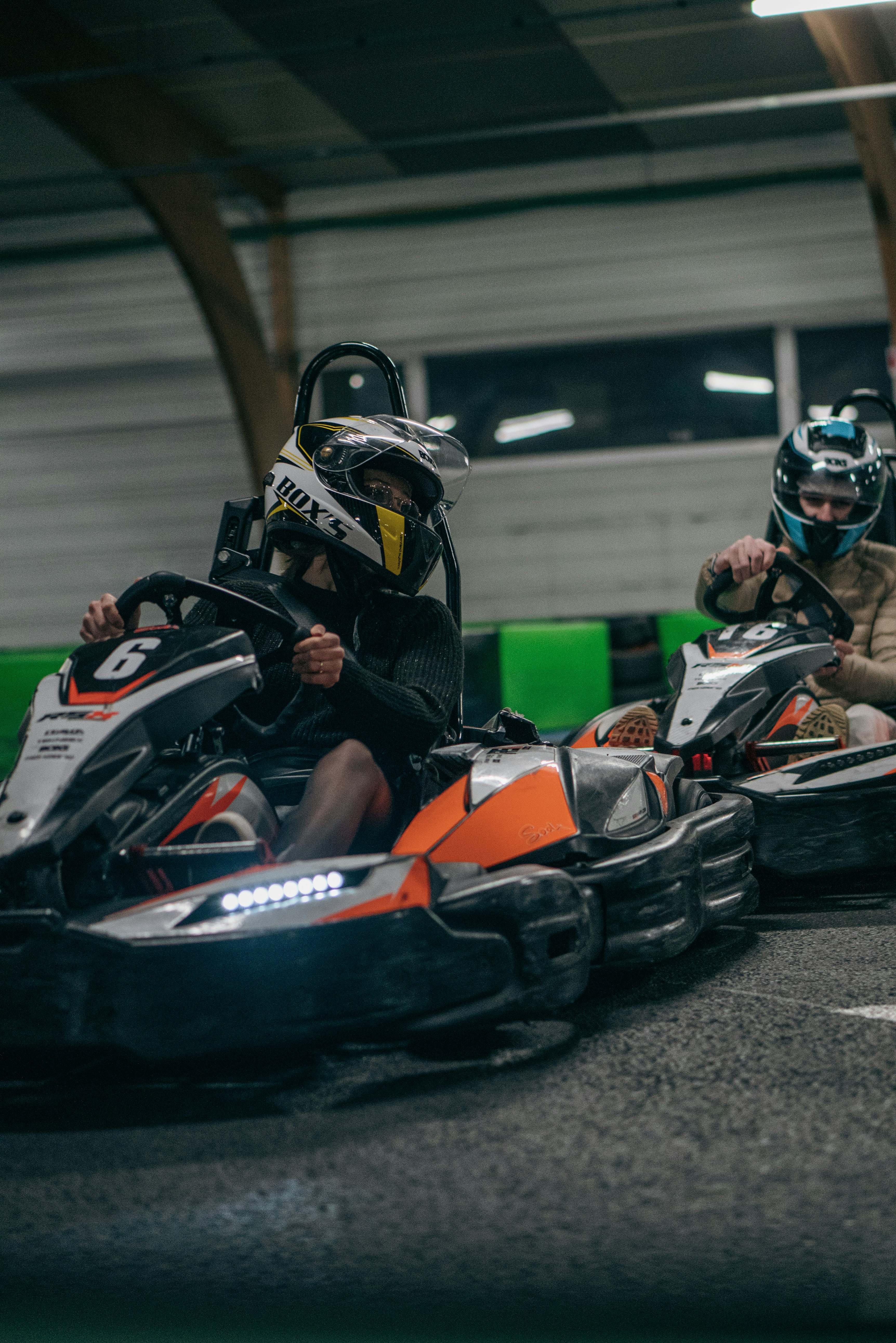 A group of people riding on top of a go - kart