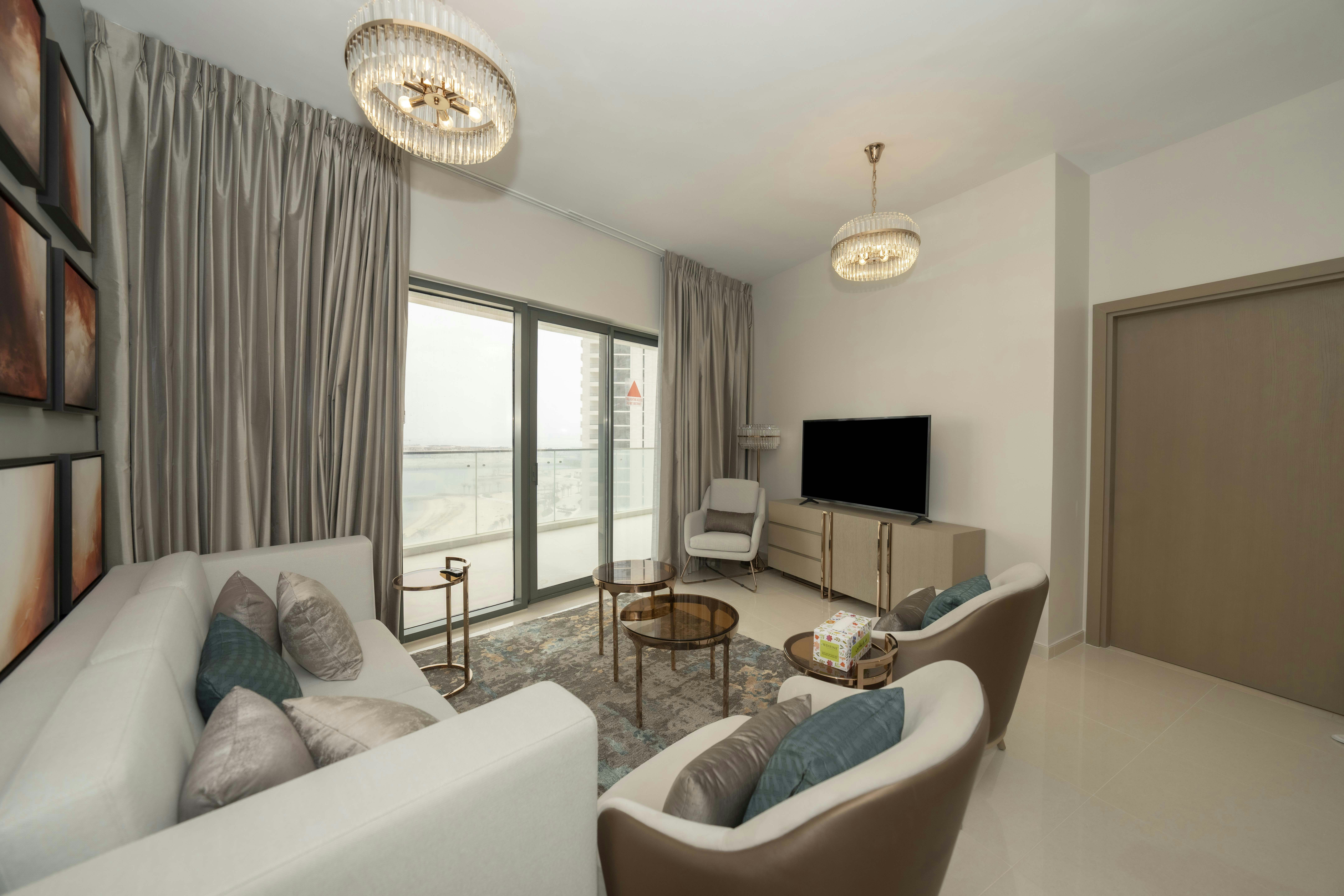 A living room filled with furniture and a flat screen TV