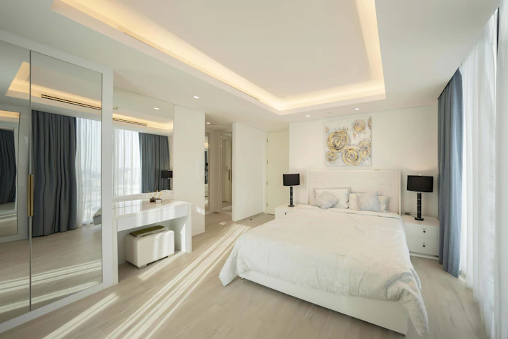 Bright luxury hotel bedroom with crisp white linen