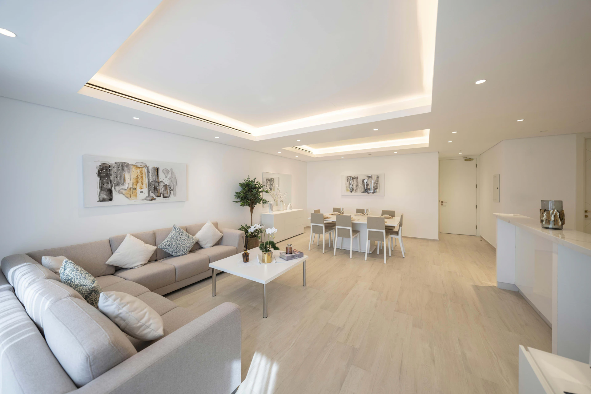 A living room filled with furniture and white walls