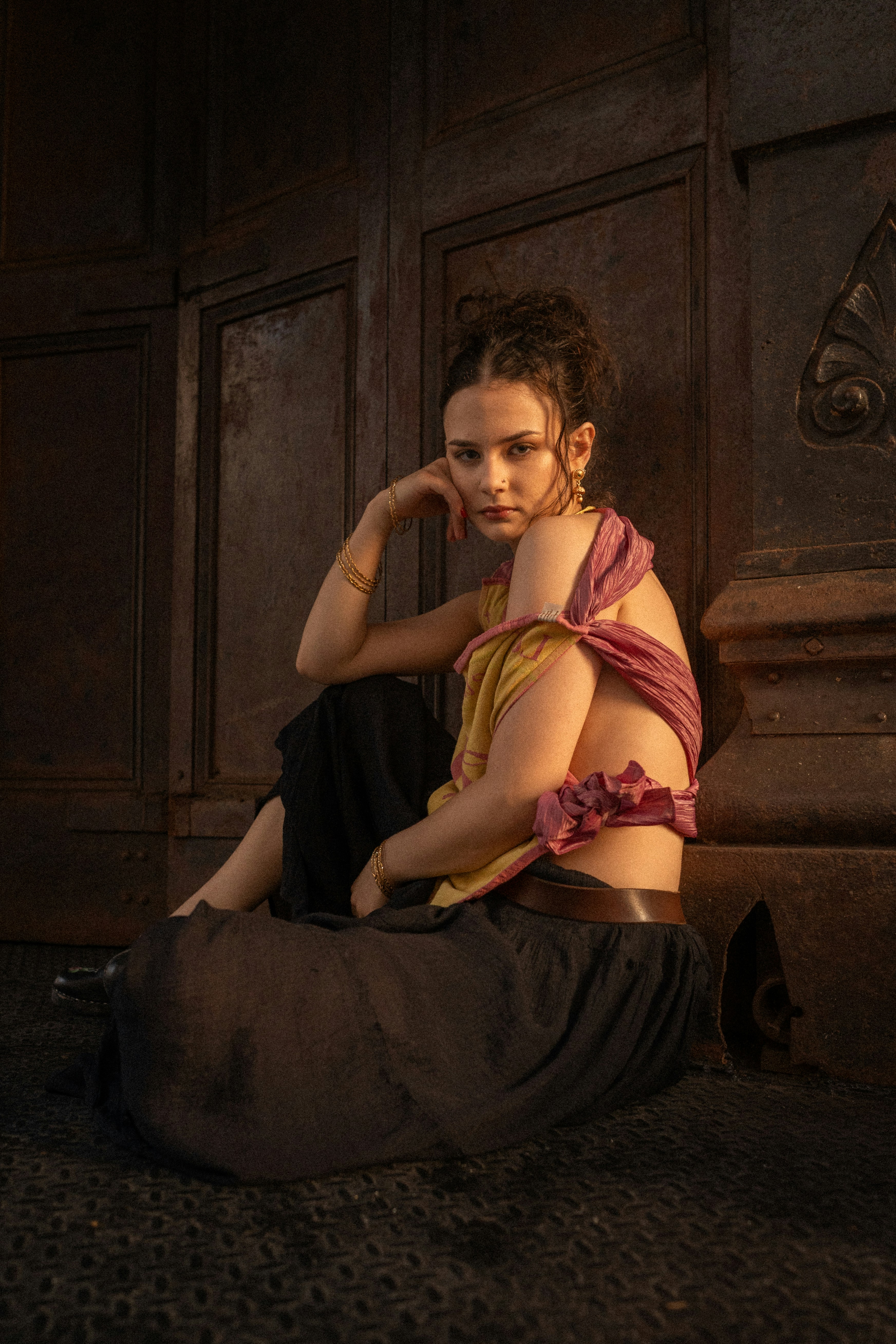 A woman sitting on the ground in a room