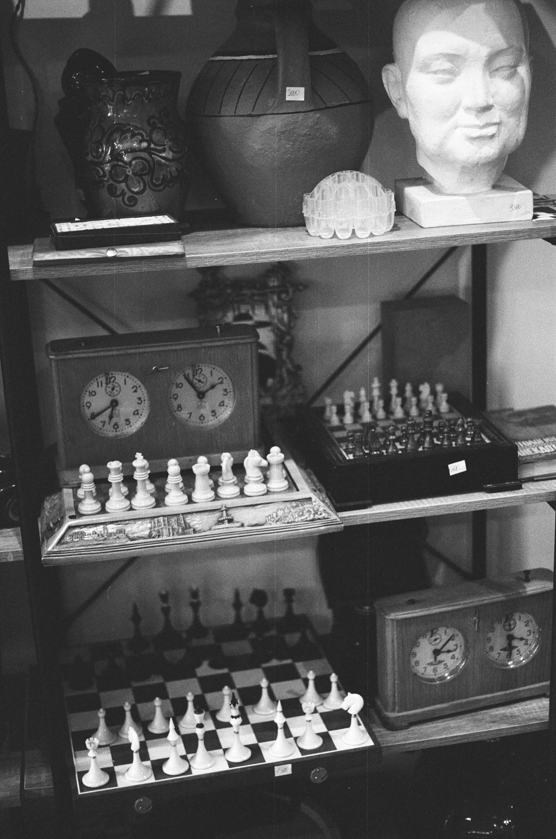 A black and white photo of a chess set