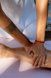 A person getting a foot massage from another person