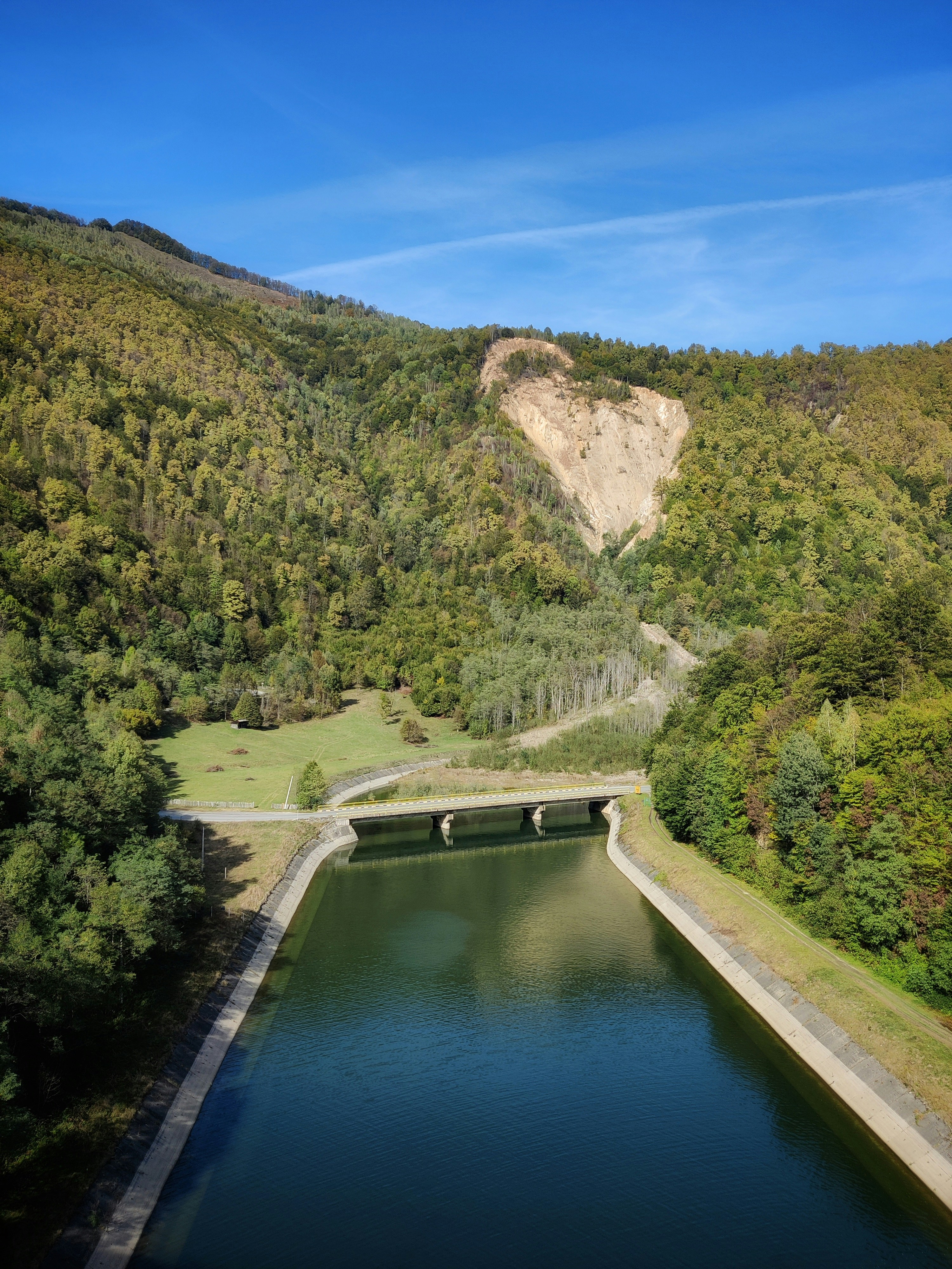 A large body of water surrounded by trees