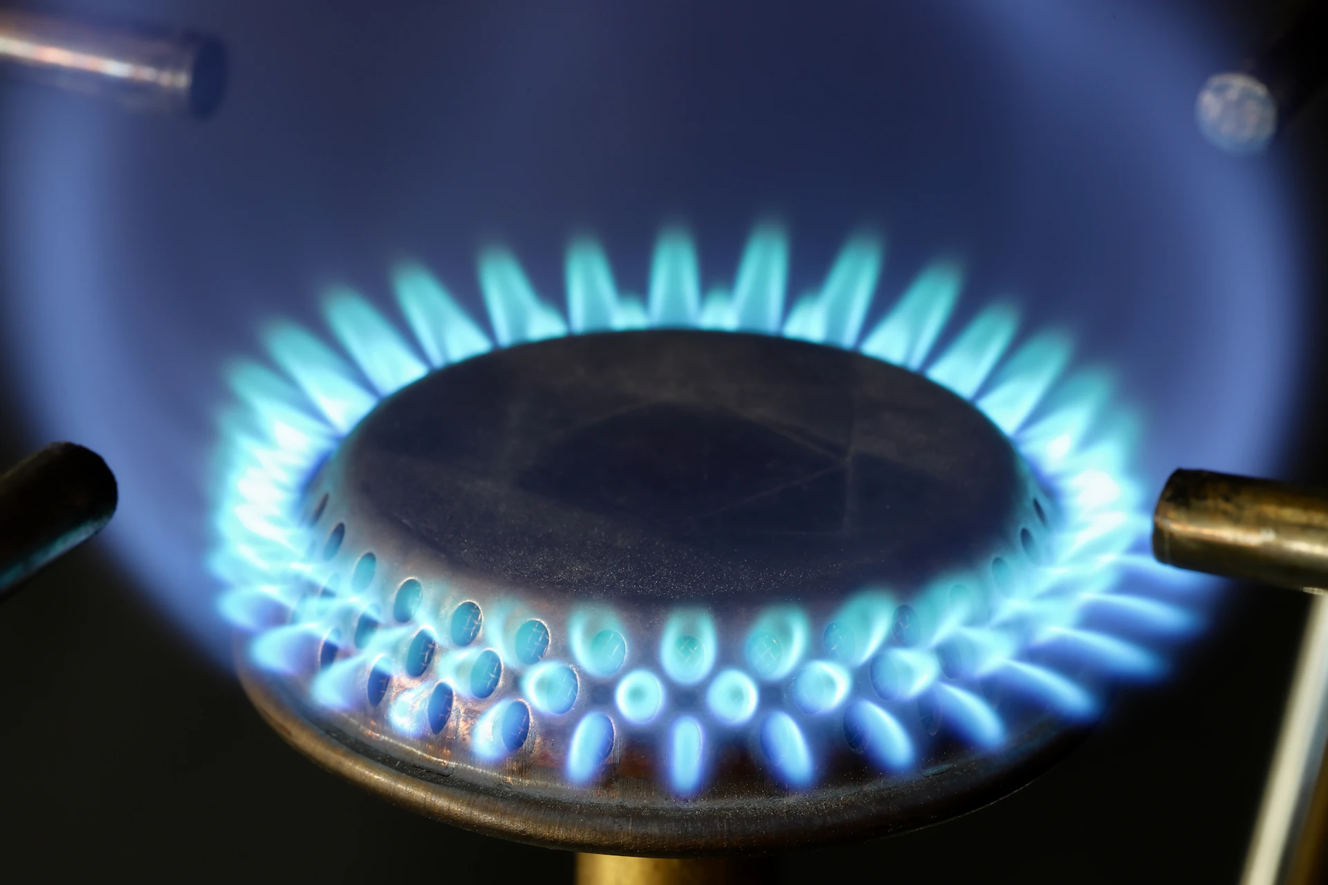 A propane burner ring glowing clean blue