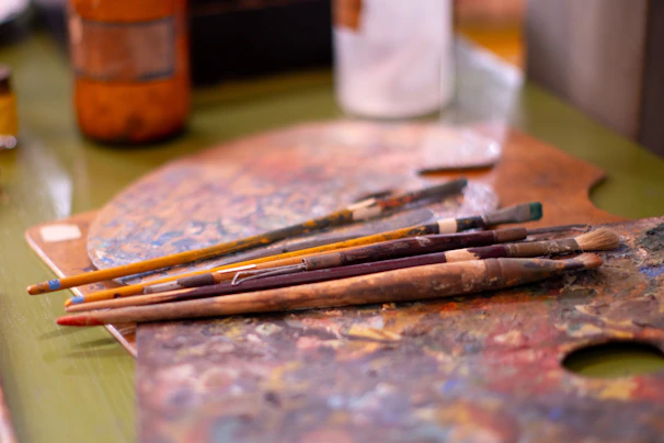 A close up of paint brushes on a table