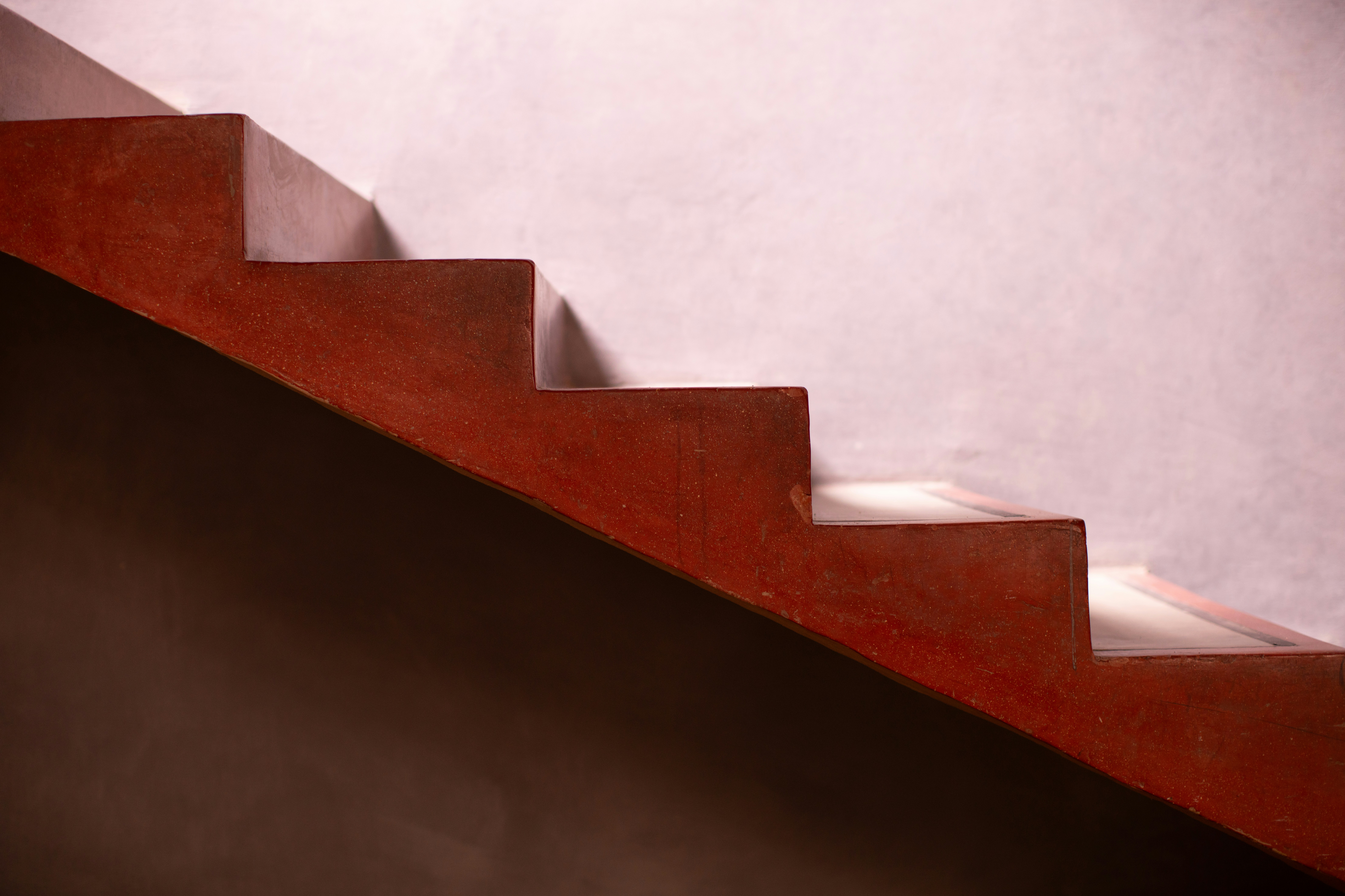 A close up of a red stair case