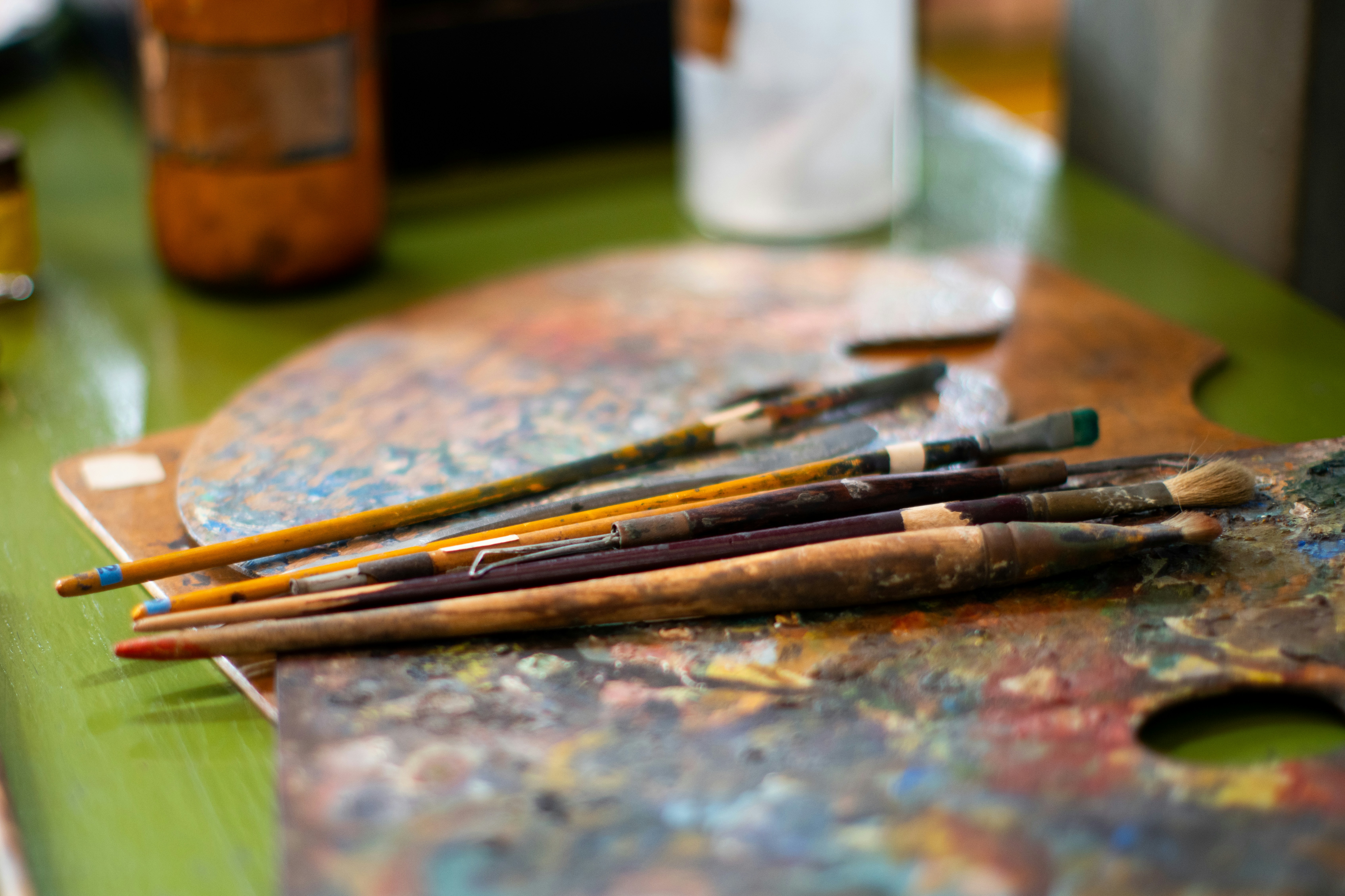 A close up of paint brushes on a table