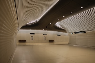 An empty room with white walls and a ceiling