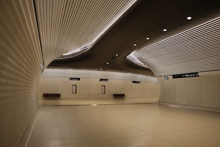 An empty room with white walls and a ceiling