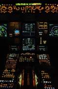 A view of the cockpit of an airplane at night